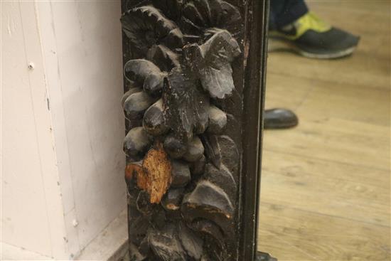 A Victorian heavily carved and painted oak overmantel W.150cm